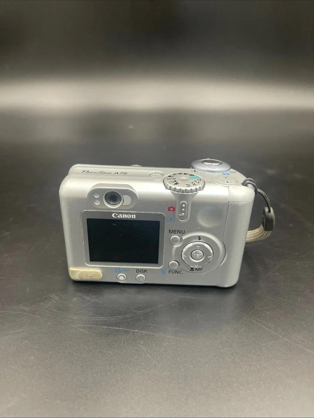 Canon Silver Compact Digital Camera with Wrist Strap powers on untested no card